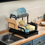 2-tier rustproof dish drying rack with drainboard, utensil holder, cup rack, and cutting board organizer for kitchen countertops.