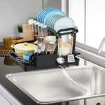 2-tier rustproof dish drying rack with drainboard, utensil holder, cup rack, and cutting board organizer for kitchen countertops.