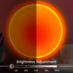 16-color sunset projection lamp creating warm ambient lighting in a modern bedroom with remote-controlled LED color-changing effects.