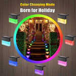 Waterproof RGB solar fence and step light illuminating outdoor garden pathway with color-changing LED lighting and crystal-style design.