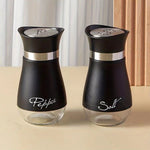Farmhouse salt and pepper shaker set with clear glass bottoms and stainless steel tops for stylish kitchen dining and everyday seasoning.