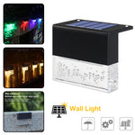 Waterproof RGB solar fence and step light illuminating outdoor garden pathway with color-changing LED lighting and crystal-style design.
