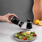 Farmhouse salt and pepper shaker set with clear glass bottoms and stainless steel tops for stylish kitchen dining and everyday seasoning.