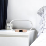 Modern LED bedside table lamp with wireless phone charging, digital clock display, USB charging port, touch controls, and dimmable lighting.