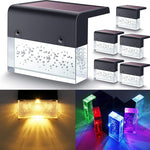 Waterproof RGB solar fence and step light illuminating outdoor garden pathway with color-changing LED lighting and crystal-style design.